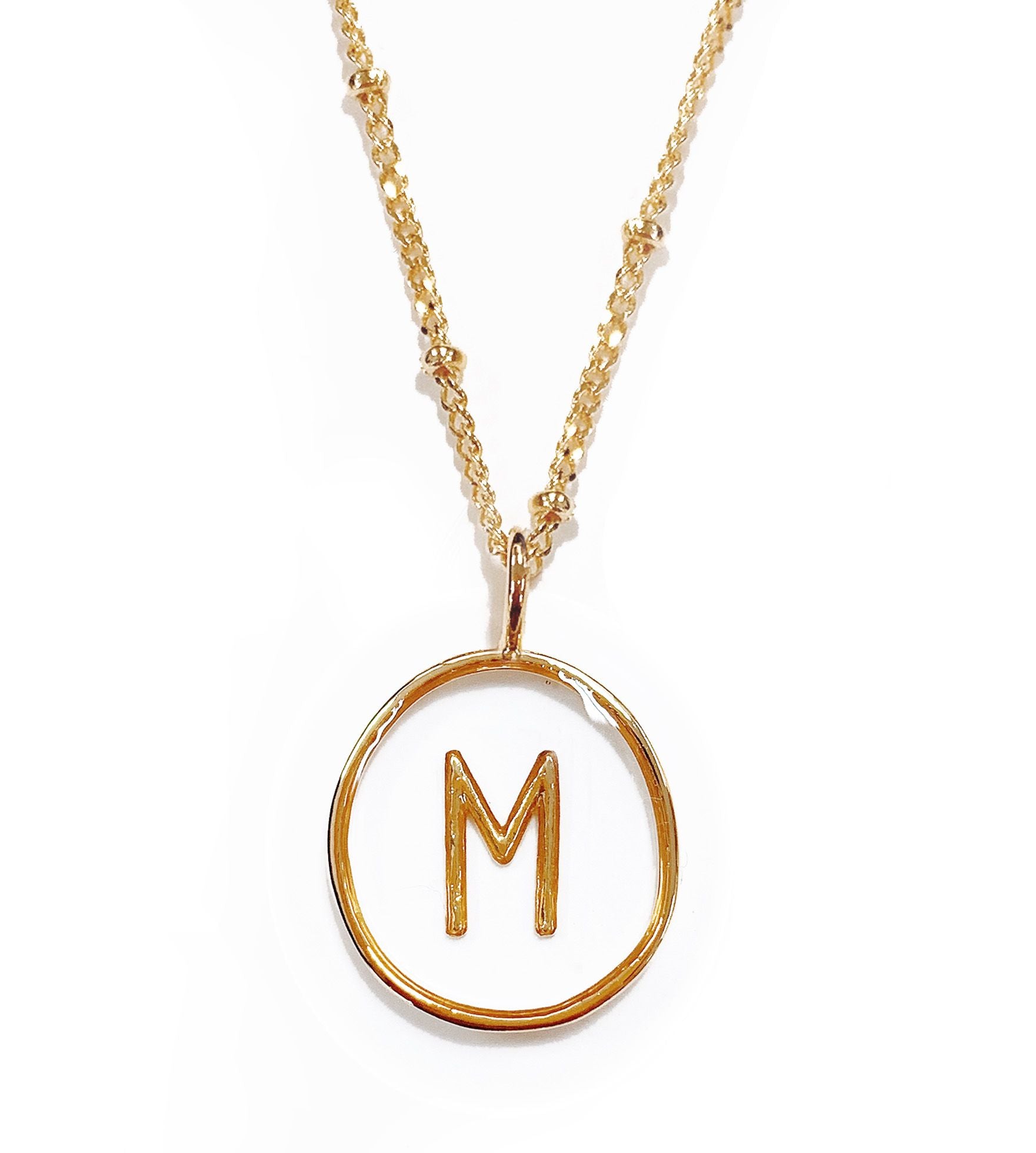 Collier acier doré pendentif lettre M transparent - 172836