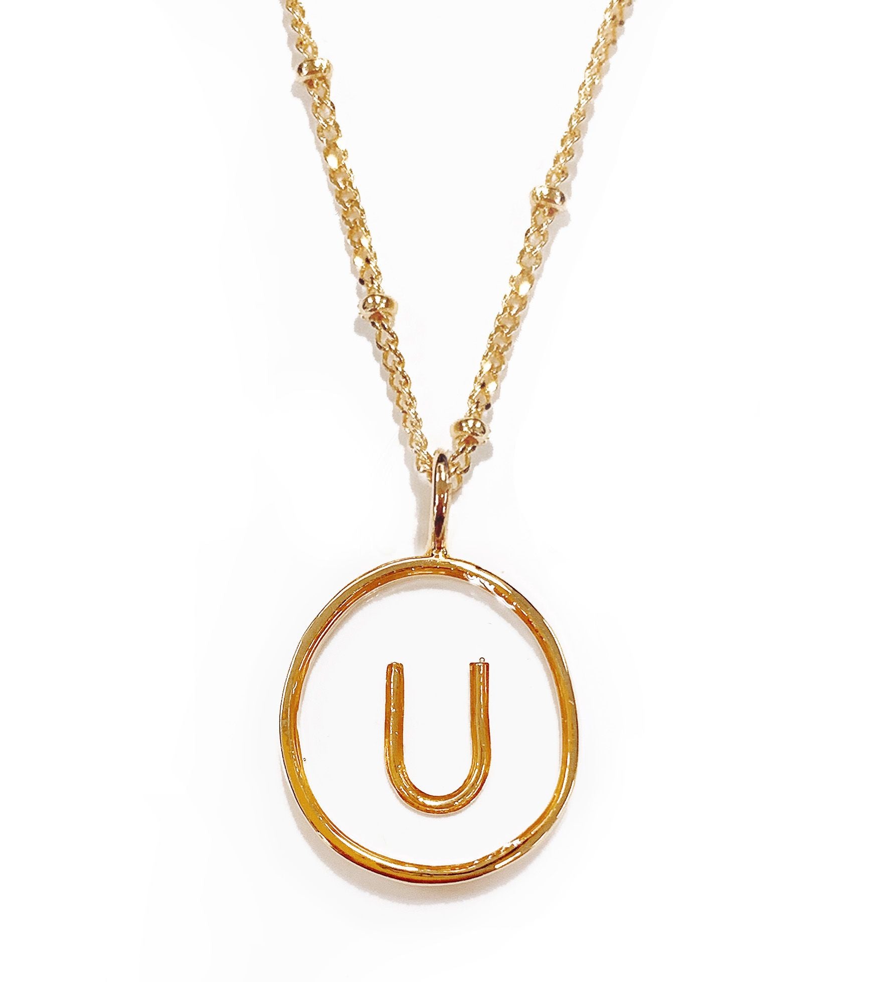 Collier doré lettre U transparent en acier - 172844
